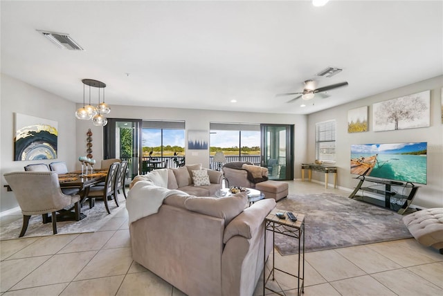 23527 Awabuki Unit 202, Venice, FL 34293 - living room featuring light tile patterned floors, ceiling fan, and recessed lighting
