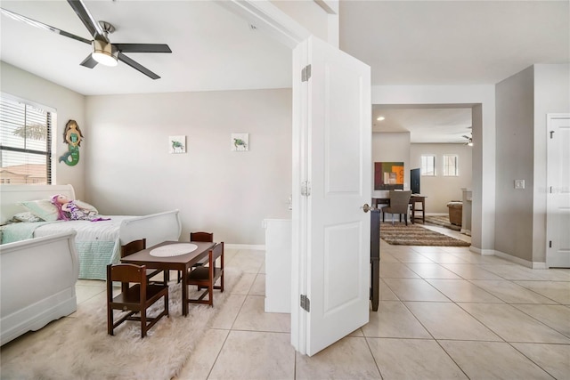 23527 Awabuki Unit 202, Venice, FL 34293 - bedroom with light tile patterned floors and baseboards