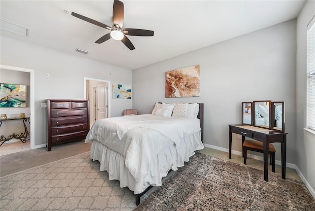 23527 Awabuki Unit 202, Venice, FL 34293 - bedroom with light colored carpet, a ceiling fan, and multiple windows