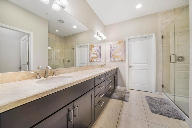 23527 Awabuki Unit 202, Venice, FL 34293 - full bathroom featuring double vanity, tile patterned floors, and a shower stall