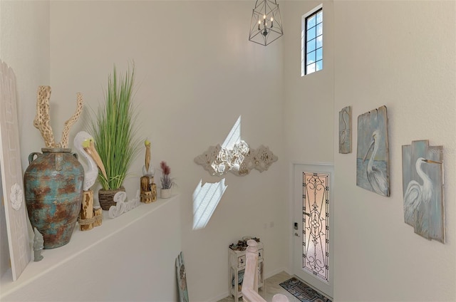 12590 Ghiberti Cir Unit 201, Venice, FL 34293 - bathroom with a chandelier and a high ceiling