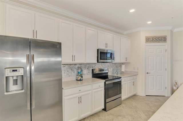 12590 Ghiberti Cir Unit 201, Venice, FL 34293 - kitchen featuring stainless steel appliances, ornamental molding, white cabinets, decorative backsplash, and recessed lighting
