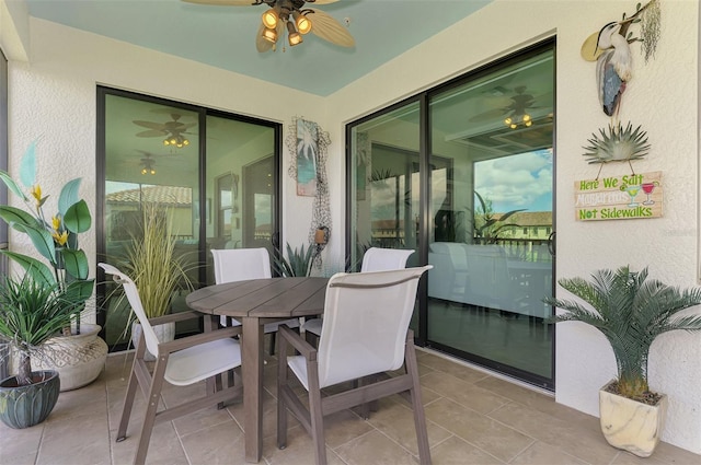 12590 Ghiberti Cir Unit 201, Venice, FL 34293 - sunroom / solarium featuring a ceiling fan and outdoor dining area