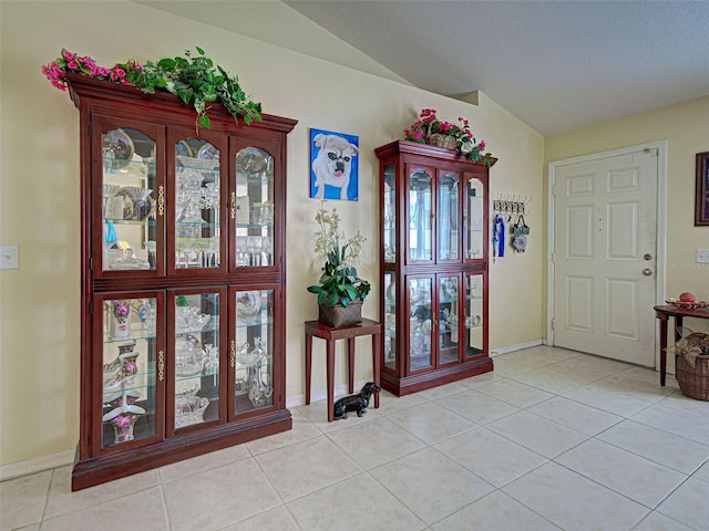 3139 Point St, North Port, FL 34286 - foyer entrance featuring vaulted ceiling and light tile patterned flooring