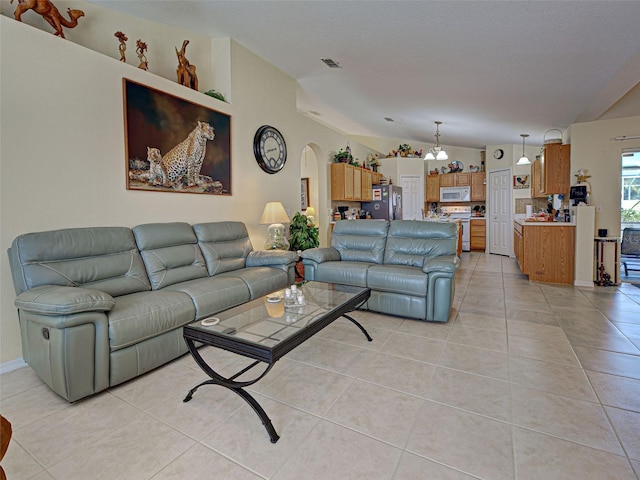 3139 Point St, North Port, FL 34286 - living room with arched walkways and light tile patterned floors