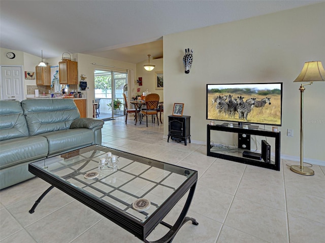 3139 Point St, North Port, FL 34286 - living area with light tile patterned floors and a wood stove