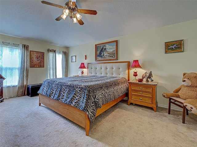 3139 Point St, North Port, FL 34286 - bedroom featuring carpet flooring, a textured ceiling, and ceiling fan