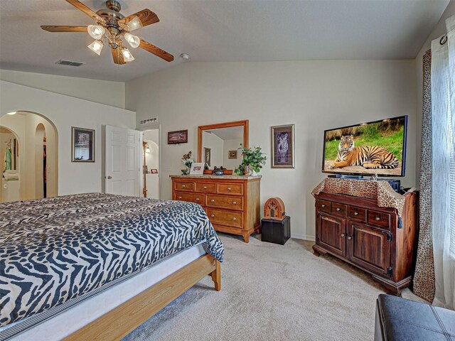 3139 Point St, North Port, FL 34286 - bedroom featuring lofted ceiling, arched walkways, light colored carpet, and ceiling fan