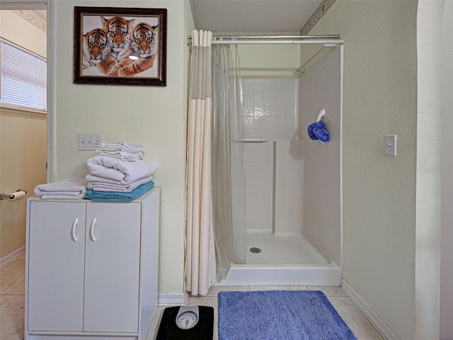 3139 Point St, North Port, FL 34286 - bathroom featuring tile patterned flooring and tiled shower