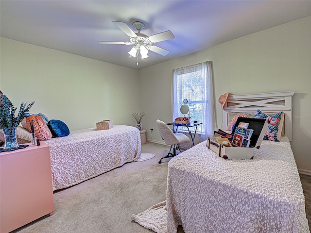 3139 Point St, North Port, FL 34286 - carpeted bedroom with a ceiling fan and baseboards