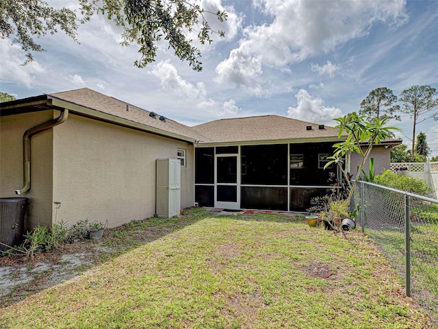 3139 Point St, North Port, FL 34286 - back of property with a sunroom and stucco siding