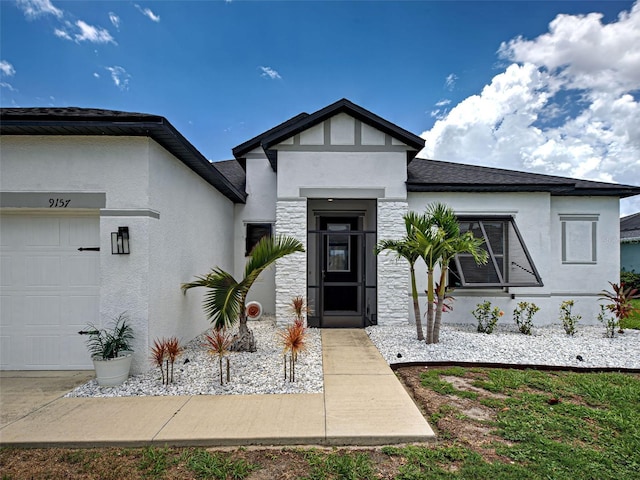 9157 Genesee St, Port Charlotte, FL 33981 - property entrance with stucco siding, a garage, and stone siding