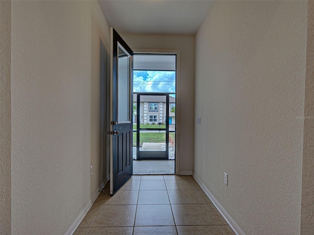 9157 Genesee St, Port Charlotte, FL 33981 - doorway featuring a textured wall and light tile patterned flooring