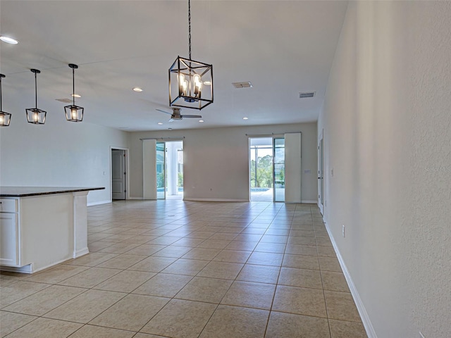 9157 Genesee St, Port Charlotte, FL 33981 - unfurnished room featuring light tile patterned floors, recessed lighting, and a chandelier