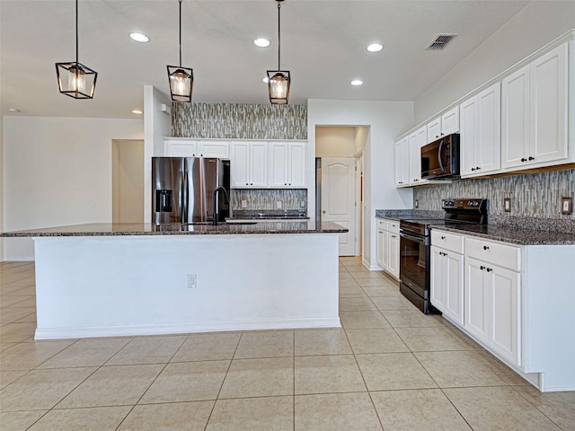 9157 Genesee St, Port Charlotte, FL 33981 - kitchen with black appliances, tasteful backsplash, light tile patterned floors, white cabinetry, and recessed lighting