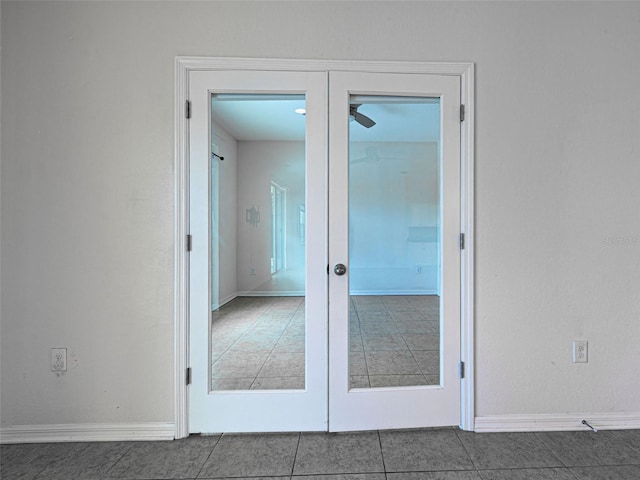 9157 Genesee St, Port Charlotte, FL 33981 - empty room with french doors, tile patterned floors, and ceiling fan
