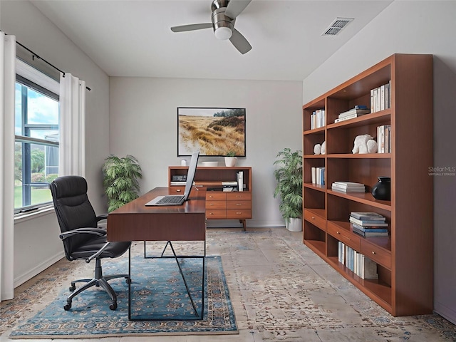 9157 Genesee St, Port Charlotte, FL 33981 - home office with ceiling fan and stone tile flooring