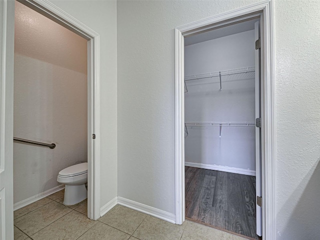 9157 Genesee St, Port Charlotte, FL 33981 - bathroom with tile patterned flooring and a walk in closet