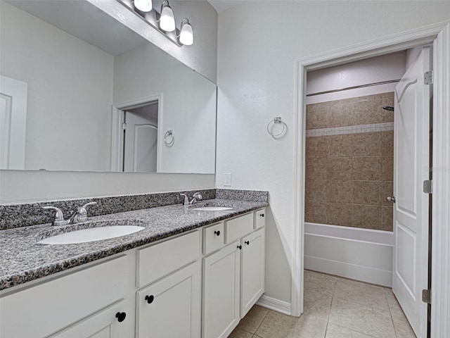 9157 Genesee St, Port Charlotte, FL 33981 - full bathroom featuring double vanity, tile patterned flooring, and bathing tub / shower combination