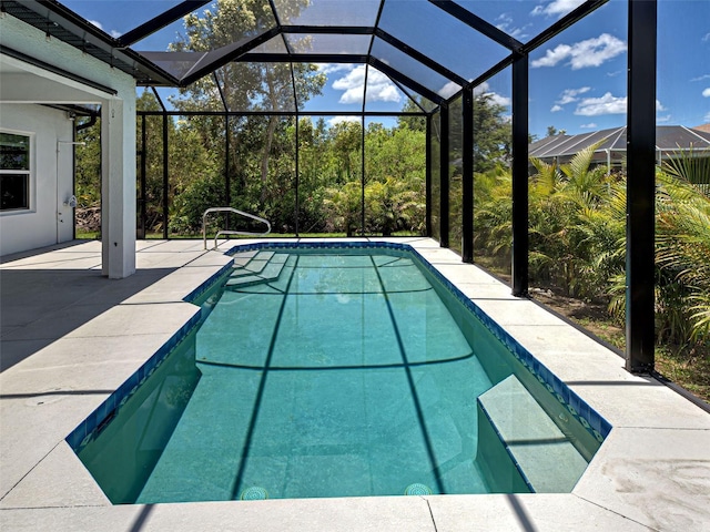 9157 Genesee St, Port Charlotte, FL 33981 - swimming pool featuring a patio area and glass enclosure