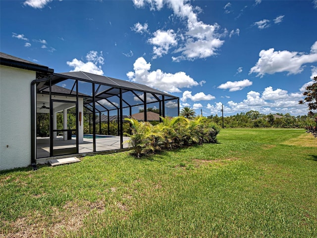 9157 Genesee St, Port Charlotte, FL 33981 - view of grassy yard with an outdoor pool, a patio area, and glass enclosure