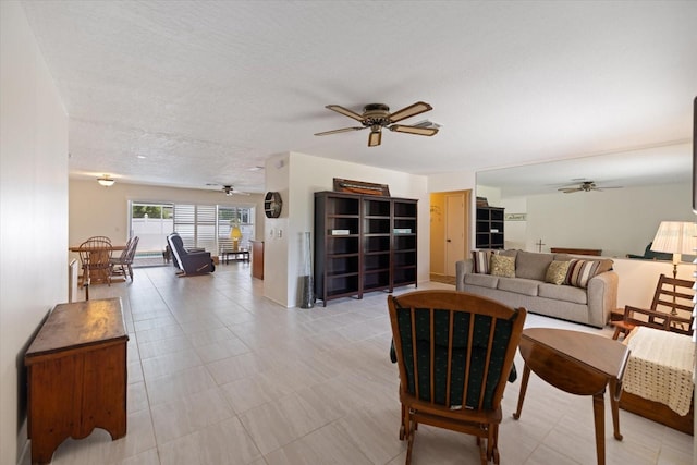 2941 Datura Rd, Venice, FL 34293 - living area featuring ceiling fan and a textured ceiling