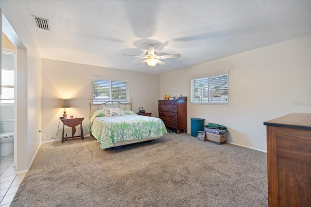2941 Datura Rd, Venice, FL 34293 - carpeted bedroom featuring a textured ceiling and a ceiling fan
