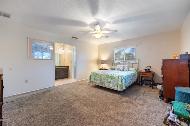 2941 Datura Rd, Venice, FL 34293 - carpeted bedroom featuring a ceiling fan and ensuite bath