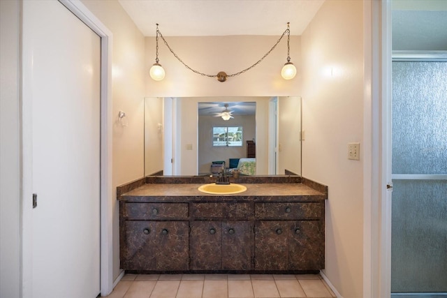 2941 Datura Rd, Venice, FL 34293 - ensuite bathroom with vanity, ceiling fan, and tile patterned floors