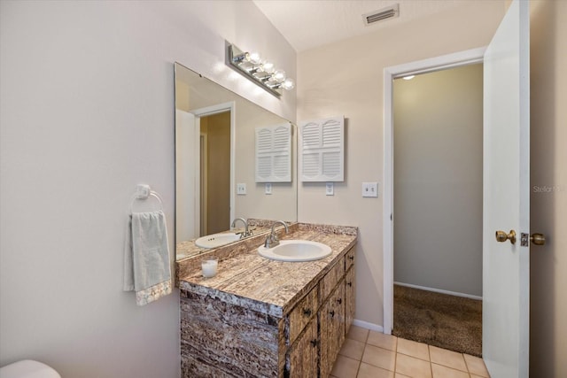 2941 Datura Rd, Venice, FL 34293 - bathroom with vanity and tile patterned flooring