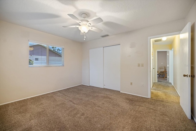 2941 Datura Rd, Venice, FL 34293 - unfurnished bedroom with carpet flooring, a closet, and ceiling fan