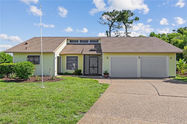 1315 Pine Needle Rd, Venice, FL 34285 - mid-century modern home featuring concrete driveway, an attached garage, a front yard, stucco siding, and a shingled roof
