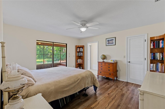 1315 Pine Needle Rd, Venice, FL 34285 - bedroom with hardwood / wood-style floors, a ceiling fan, and a textured ceiling