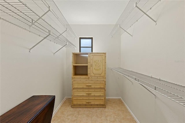 1315 Pine Needle Rd, Venice, FL 34285 - walk in closet with light tile patterned floors