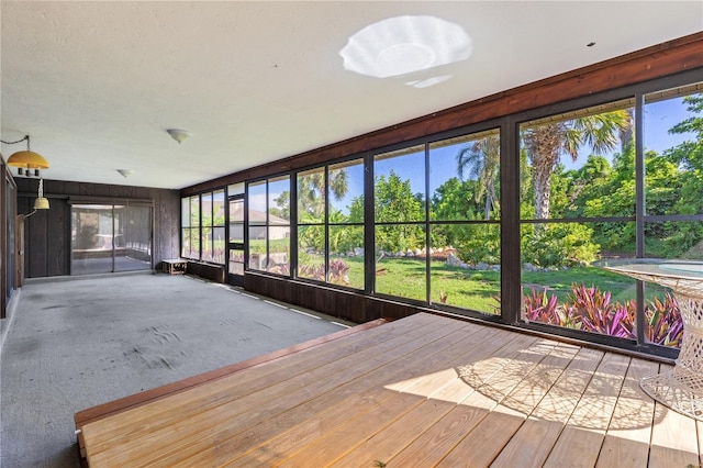 1315 Pine Needle Rd, Venice, FL 34285 - unfurnished sunroom featuring a deck
