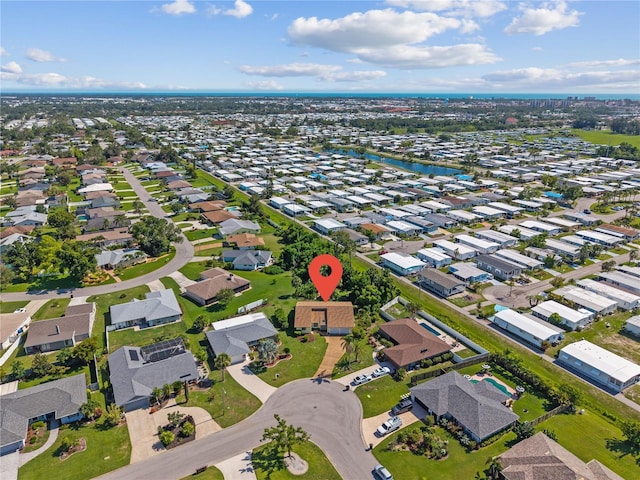 1315 Pine Needle Rd, Venice, FL 34285 - aerial view of property and surrounding area with nearby suburban area and a large body of water