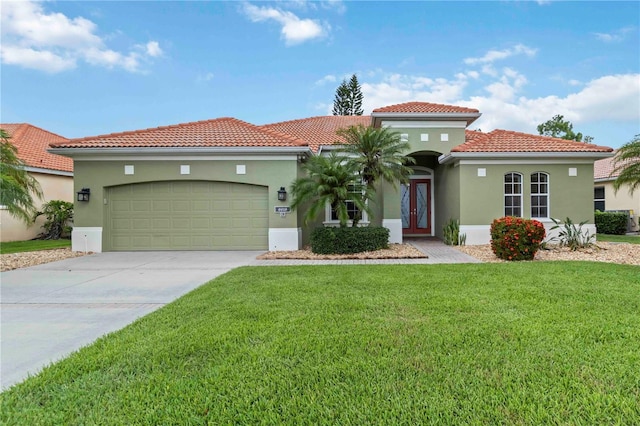 6619 Pinefeather Ct, Bradenton, FL 34203 - mediterranean / spanish house featuring a front lawn, a garage, a tile roof, and stucco siding
