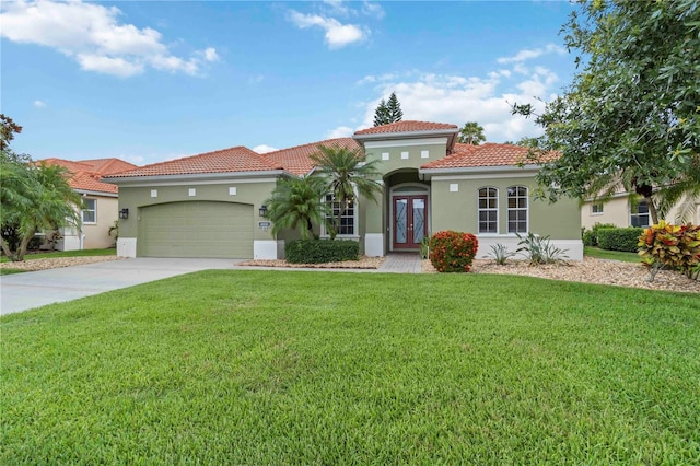6619 Pinefeather Ct, Bradenton, FL 34203 - mediterranean / spanish-style house featuring a tiled roof, stucco siding, a front yard, and a garage