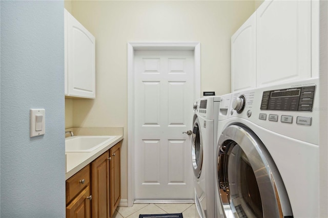 6619 Pinefeather Ct, Bradenton, FL 34203 - washroom with washing machine and dryer, cabinet space, and light tile patterned floors