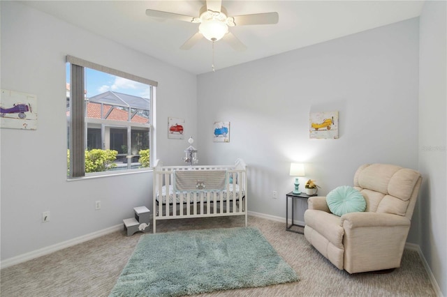 6619 Pinefeather Ct, Bradenton, FL 34203 - bedroom with a nursery area, carpet floors, and ceiling fan