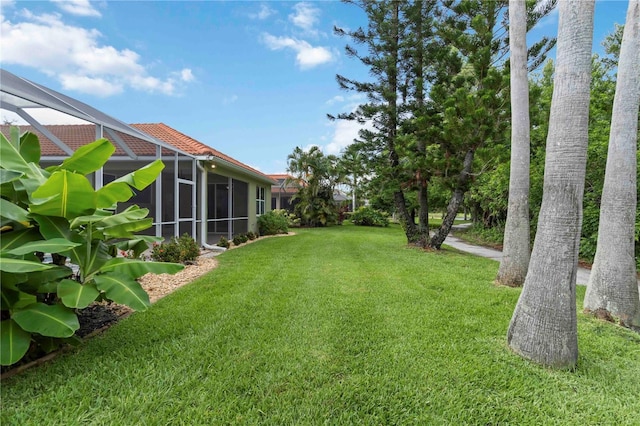 6619 Pinefeather Ct, Bradenton, FL 34203 - view of grassy yard featuring a lanai