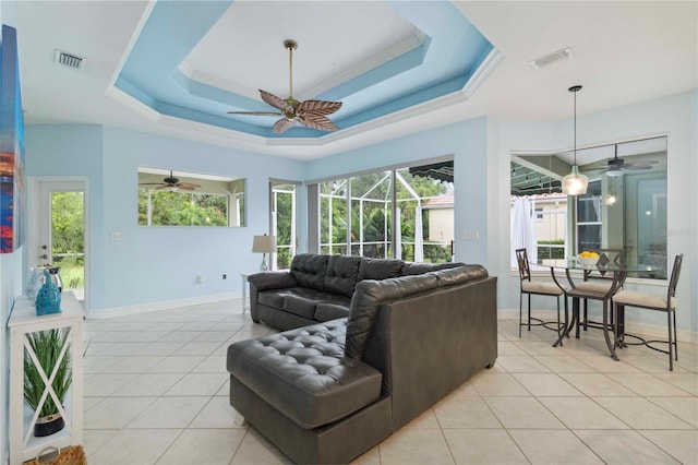 6619 Pinefeather Ct, Bradenton, FL 34203 - living area with a ceiling fan, light tile patterned flooring, and a raised ceiling