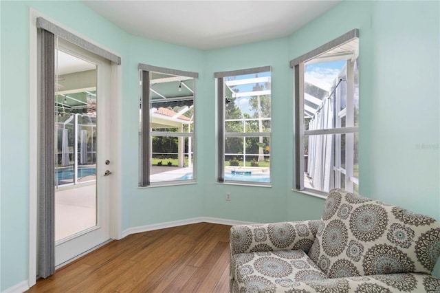 6619 Pinefeather Ct, Bradenton, FL 34203 - living area with wood finished floors and baseboards