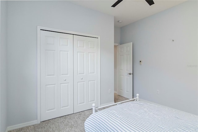 6619 Pinefeather Ct, Bradenton, FL 34203 - bedroom with light carpet, a closet, and ceiling fan