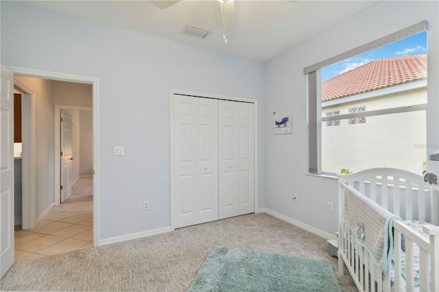 6619 Pinefeather Ct, Bradenton, FL 34203 - unfurnished bedroom featuring carpet flooring, a closet, ceiling fan, and a nursery area