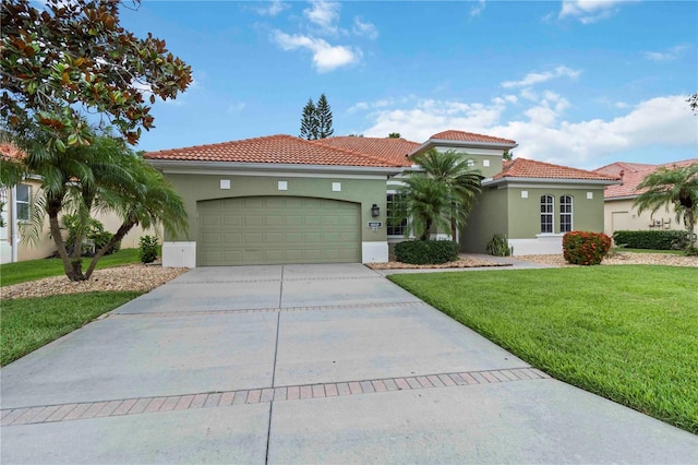 6619 Pinefeather Ct, Bradenton, FL 34203 - mediterranean / spanish house featuring driveway, a garage, stucco siding, a front lawn, and a tiled roof