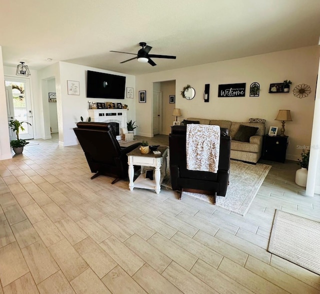 4033 Union Ln, North Port, FL 34288 - living room featuring a ceiling fan, wood finish floors, and a fireplace