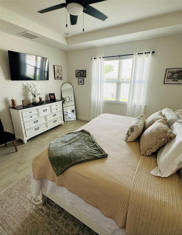4033 Union Ln, North Port, FL 34288 - bedroom with light wood finished floors and ceiling fan