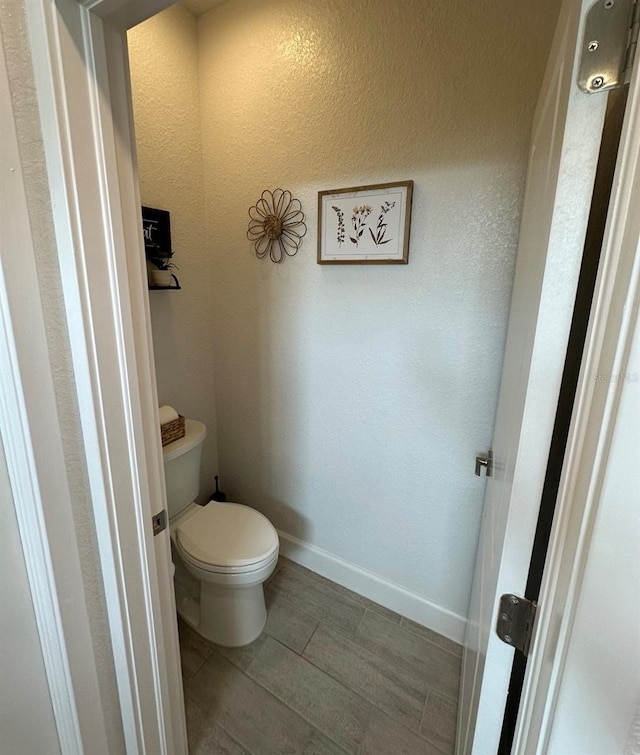 4033 Union Ln, North Port, FL 34288 - bathroom featuring toilet and wood finish floors