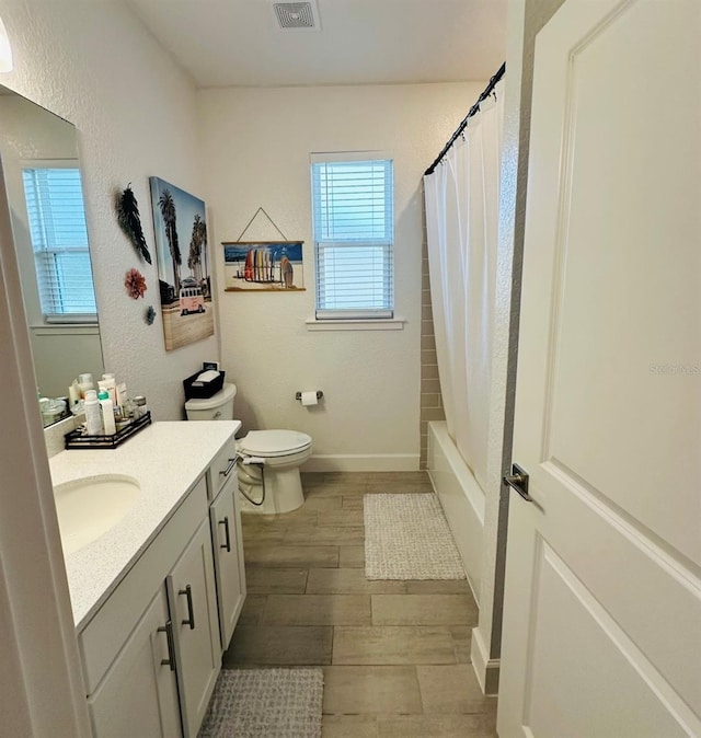 4033 Union Ln, North Port, FL 34288 - full bathroom featuring vanity, wood finished floors, and shower / bathtub combination with curtain
